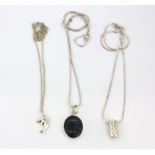 Three 925 silver stone set pendants.