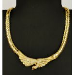 A 14ct yellow gold (stamped 14k) swan shaped necklace set with brilliant cut diamonds and cabochon