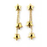 A pair of 9ct yellow gold star shaped drop earrings, L. 4cm.