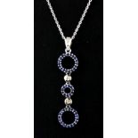 An 18ct white gold sapphire and diamond set pendant and chain, L. 4.5cm.