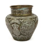 Islamic interest. A 19th Century silver and copper decorated brass vase, H. 21cm.