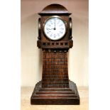 A four sided oak lighthouse clock, with alarm movement on the base, H. 38cm. Condition : small parts