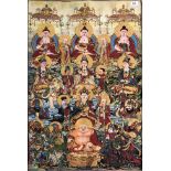A Tibetan Buddhist woven and gilt thread thangka of the Buddha and other deitys, 89 x 59cm. Good