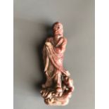 A mid 20thC Chinese carved soapstone figure of a Lohan. H. 15cms. Good with some age related wear.