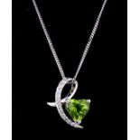 A 9ct white gold pendant and chain and matching pair of earrings, set with heart cut peridots and