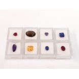 Eight individually boxed gemstones, rubies, amethyst, etc.