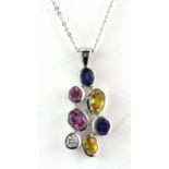 An 18ct white gold pendant and chain set with fancy coloured sapphires and a diamond, L. 3cm.