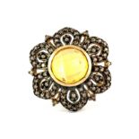 A 9ct yellow gold shaped ring set with faceted citrine and fancy yellow diamonds, (O.5).