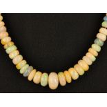 A graduated opal bead necklace, L. 43cm.