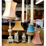 Four mixed table lamps and shades, three ceramic and one carved wood, tallest H. 105cm.