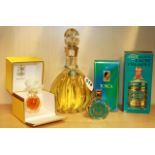 Five vintage bottles of perfume.