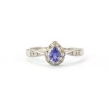 A 9ct white gold tanzanite and diamond set ring, (N).