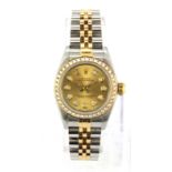 A lady's stainless steel Rolex gilt wrist watch with diamond set bezel and face. Understood to be in