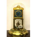 A vintage gilt and enamelled torsion pendulum clock with glass dome, overall H. 29cm. Condition -