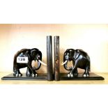A pair of carved figured ebony elephant shaped book ends, H. 15cm.