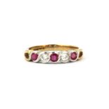 A 9ct yellow and white gold ruby and diamond set half eternity ring, (M.5).