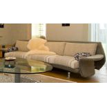 A contemporary Fly Il Loft three seater linear upholstered sofa in supple fluent shapes with