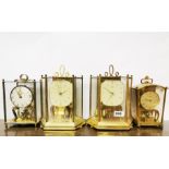 Four vintage torsion pendulum clocks, tallest overall H. 25cm. Condition - Good, working condition