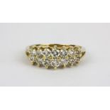 A 14ct yellow gold ring set with two rows of graduated brilliant cut diamonds, approx. 1ct