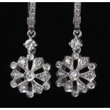 A pair of 18ct white gold diamond set drop earrings, L. 2.5cm.