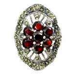 A 925 silver and marcasite ring set with garnets, (R).