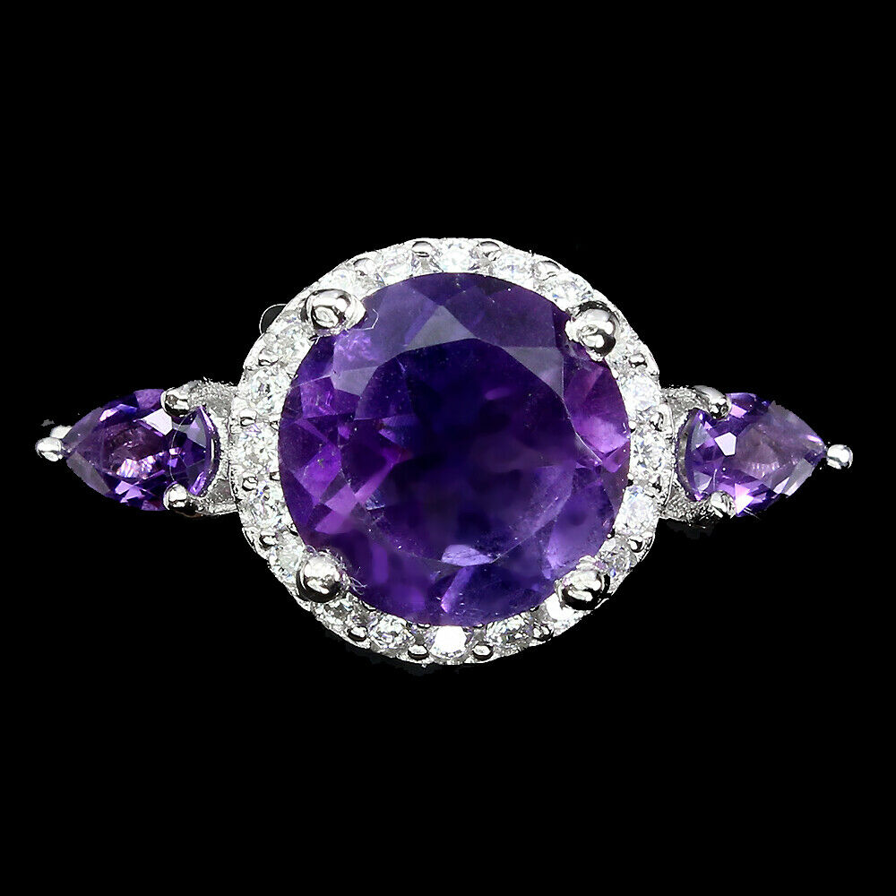 A 925 silver ring set with round and pear cut amethysts, (M).
