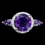 A 925 silver ring set with round and pear cut amethysts, (M).