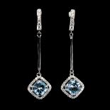 A pair of 925 silver drop earrings set with cushion cut blue topaz and white stones, L. 4.5cm.