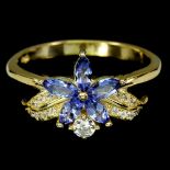 A 925 silver gilt flower shaped ring set with marquise cut tanzanites and white stones, (Q).