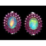 A pair of 925 silver cluster earrings set with cabochon cut opals surrounded by two rows of