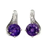 A pair of 925 silver earrings set with round cut amethysts and white stones, L. 1.2cm.