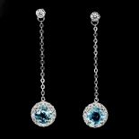 A pair of 925 silver drop earrings set with round cut Swiss blue topaz and white stones, L. 4.5cm.