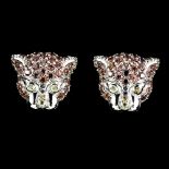 A pair of 925 silver tiger head shaped stud earrings set with fancy yellow and orange sapphires,