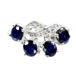 A 925 silver ring set with sapphires and white stones, (M).