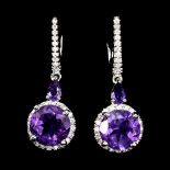 A pair of 925 silver drop earrings set with round cut amethysts and white stones, L. 3.2cm.