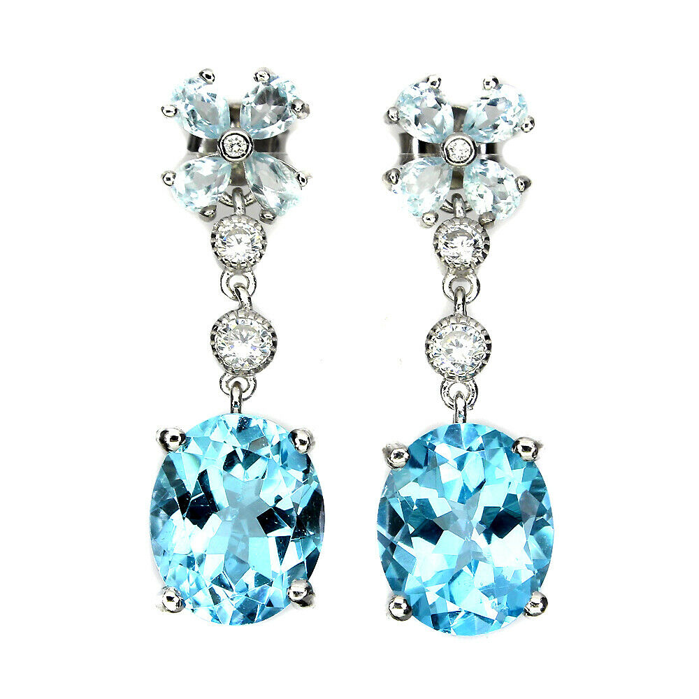 A pair of 925 silver drop earrings set with aquamarines and oval cut Swiss blue topaz, L. 3cm.