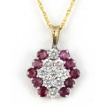 A 9ct yellow gold ruby and white stone set pendant and chain, L. 2cm.