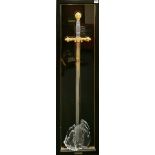A large frame mounted Excalibur sword, framed size 40 x 130cm.