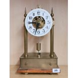 An unusual early 20th century electric brass mantle clock with front to back magnetic pendulum, H.