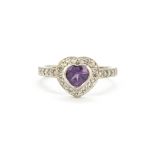 A 9ct white gold ring set with heart cut amethyst and diamonds, (P).
