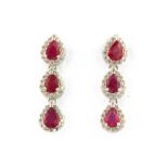 A pair of 925 silver drop earrings set with pear cut rubies and cubic zirconia, L. 2.5cm.