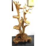 An interesting natural hardwood tree trunk plant stand, H. 155cm.