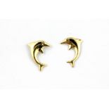 A pair of 9ct yellow gold dolphin shaped stud earrings, L. 1.1cm.