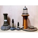Three Cornish granite lighthouses, tallest H. 23cm and a vintage lighthouse table lamp, H. 33cm.