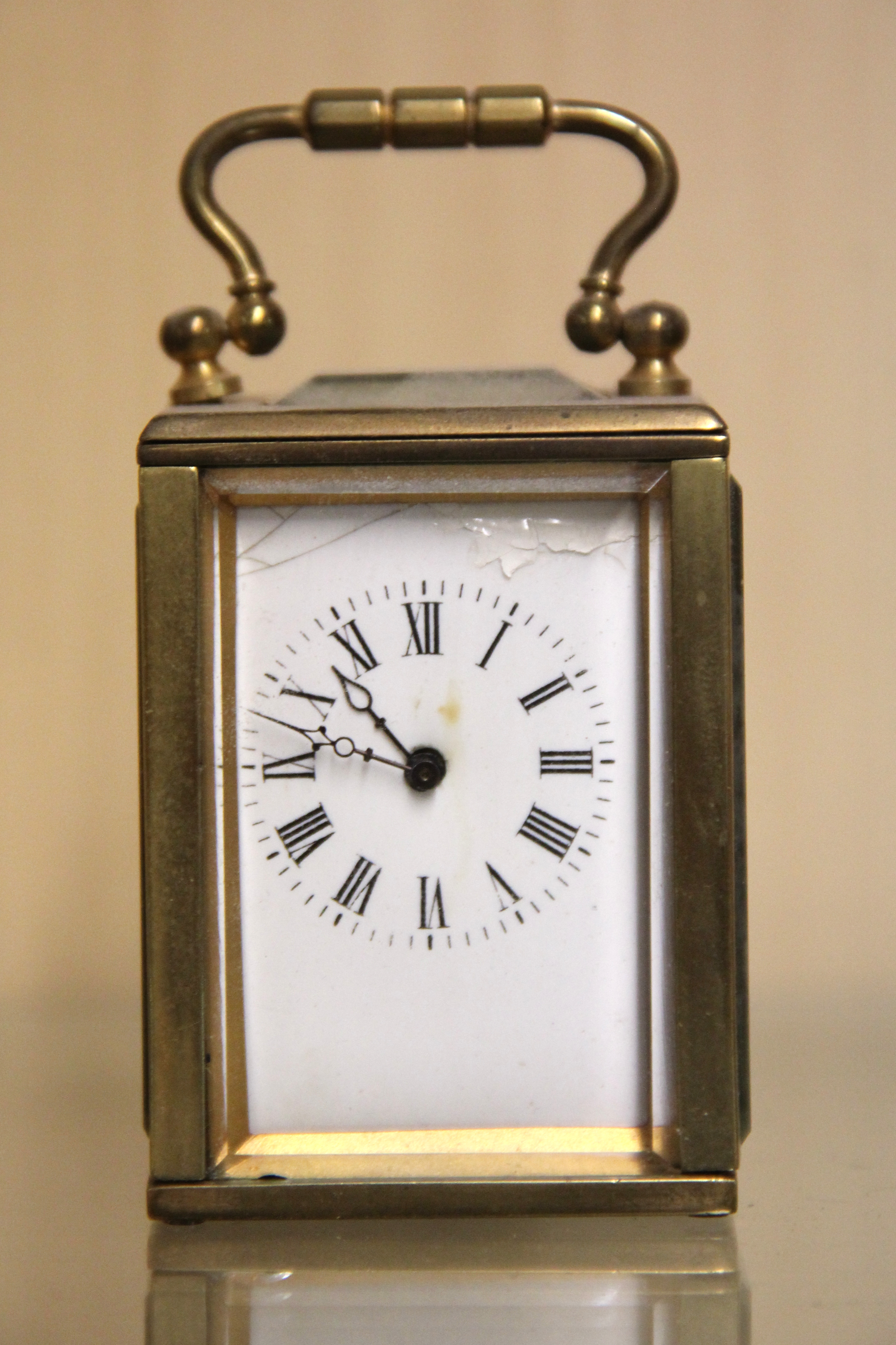 A miniature brass carriage clock, H. 9cm. Condition: dial enamel damaged, working condition