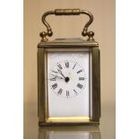 A miniature brass carriage clock, H. 9cm. Condition: dial enamel damaged, working condition