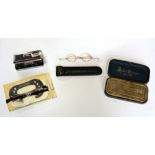 A leather cased pair of Victorian gold plated spectacles, a pair of folding binoculaurs, a cased