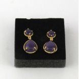 A pair of silver gilt and lavender jade earrings, L. 2.5cm.