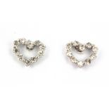 A pair of 18ct white gold diamond set heart shaped stud earrings, L. 0.5cm.