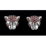 A pair of 925 silver tiger head shaped stud earrings set with fancy yellow and orange sapphires,